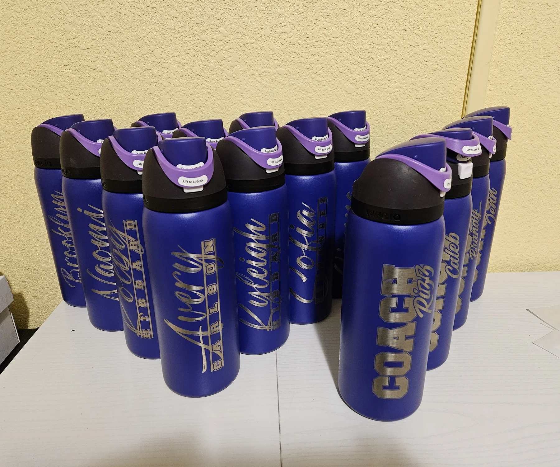 Group of real personalized Owala bottles